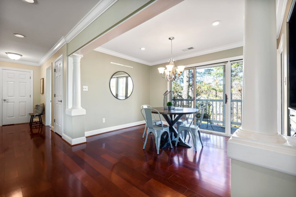 Elegant dining area featuring a round table and bright natural lighting.
